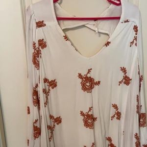 Free people white dress with orange embroidery.